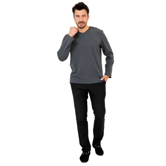 male model wearing graphite grey adam long sleeve shirt and black pants front view on white background
