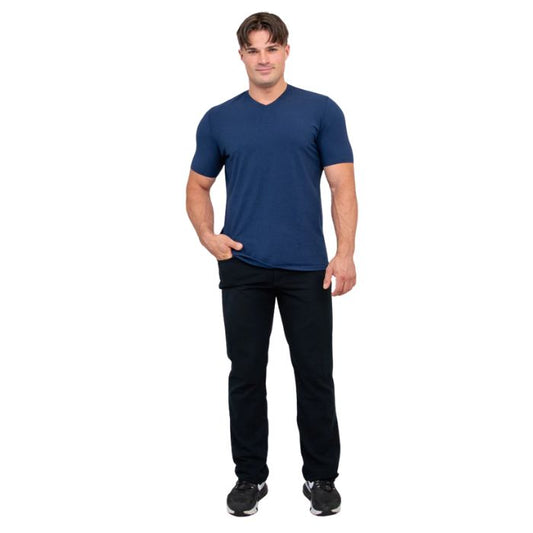 male model wearing indigo blue adam short sleeve shirt and black pants front view on white background