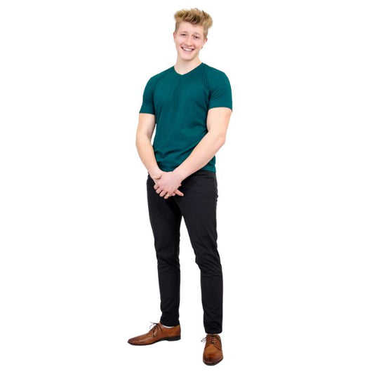 male model wearing teal green adam short sleeve shirt and black pants front view on white background
