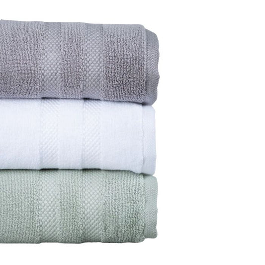 stacked grey, white, desert sage green bath towels side view on white background