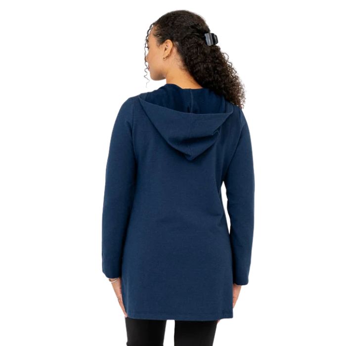 a woman wearing indigo blue cortes jacket waist up back view set on a studio white background