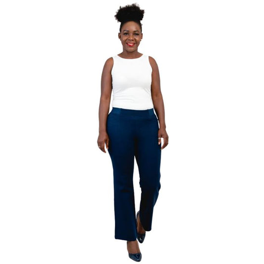 female model wearing indigo blue daya petite pants and white reanna tank top front view on white background