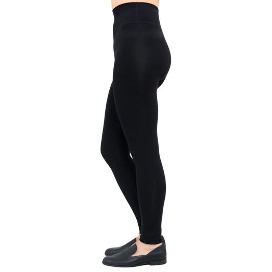 bottom of female model wearing dixie black fleece leggings side view on white background