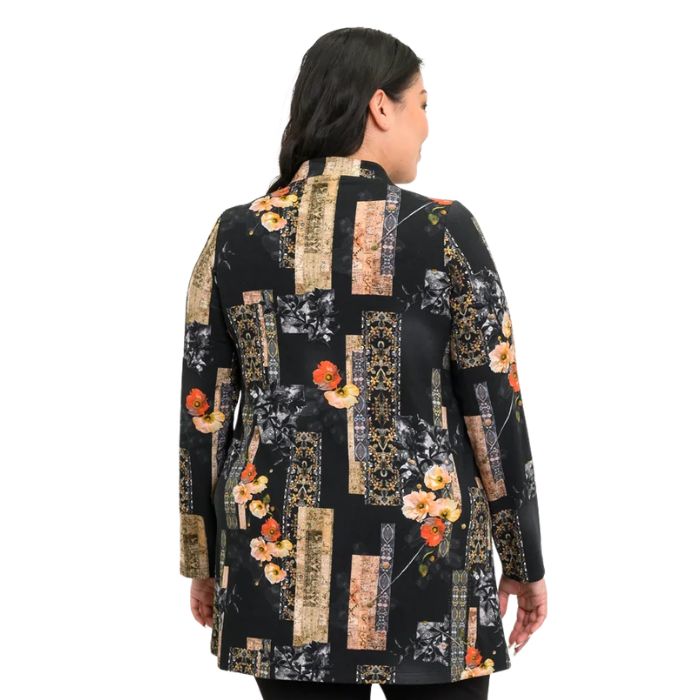 a woman wearing golden garden print edwina tunic waist up back view set on a studio white background