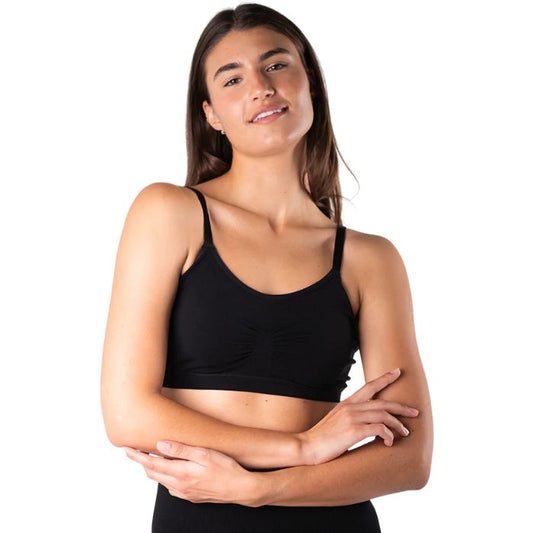 female model wearing black seamless adjustable bralette front view on white background