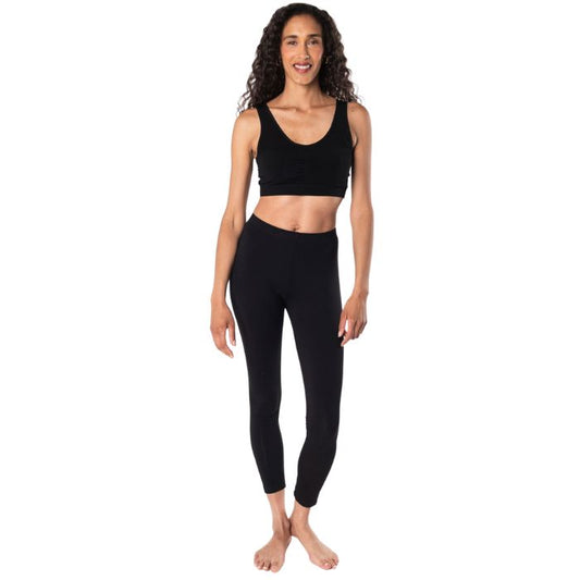 female mode wearing black essential bralette and black suri leggings front view on white background