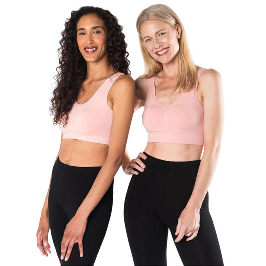 female models wearing pink terrera essential v-neck bralette and black suri leggings front view on white background