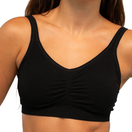 female model wearing black terrera everyday adjustable bralette front view on white background