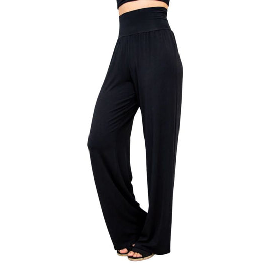 female model wearing black gaylene pants side view on white background