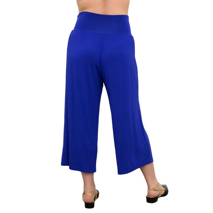 female model wearing violet purple gaylene capri pants back view on white background