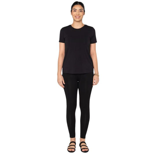top of female model wearing black gracie crew neck t-shirt and black terry leggings front view on white background