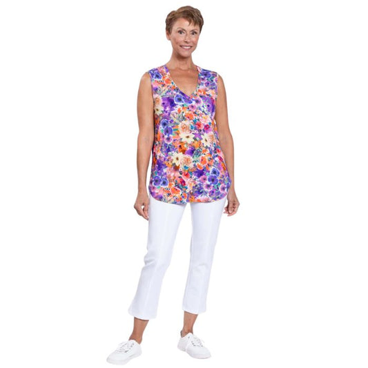 female model wearing violet fiesta print jackie tank top and white nadine cropped pants front view on white backround