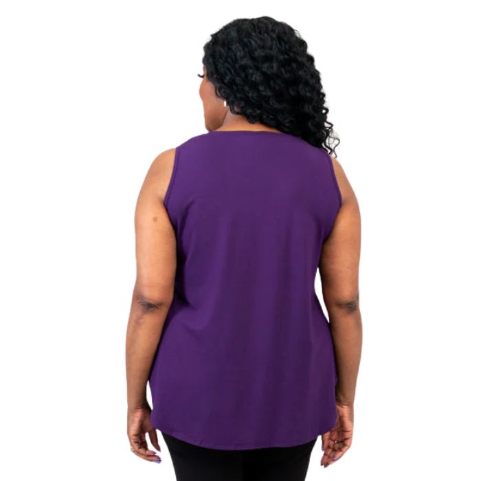 female model wearing royale purple jazz tank top and black nadia pants back view on white background