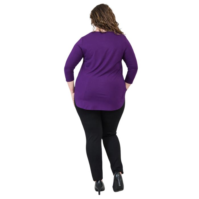 female model wearing jazz royal purple three quarter sleeve top and nadia black pants back view on white background