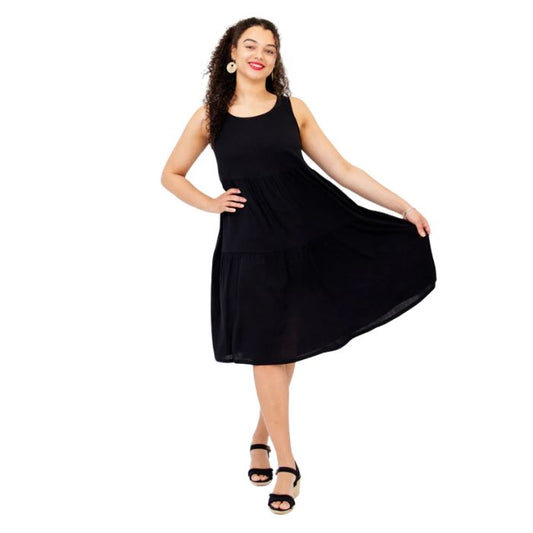 female model wearing black juni dress front veiw on white background