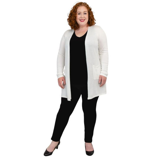 female model wearing white justine draped cardigan sweater over black reanna tank top and black nadia pants front view on white background