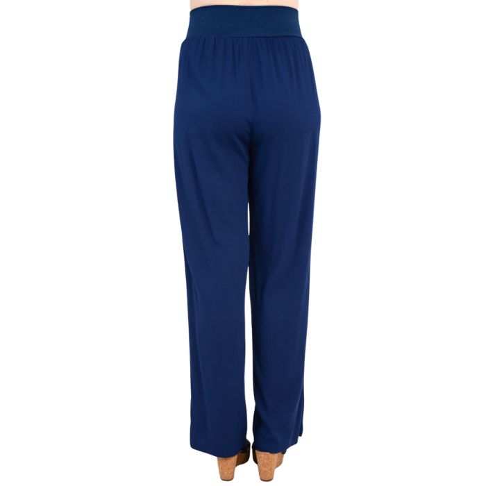 female model wearing indigo blue landon pants back view on white background