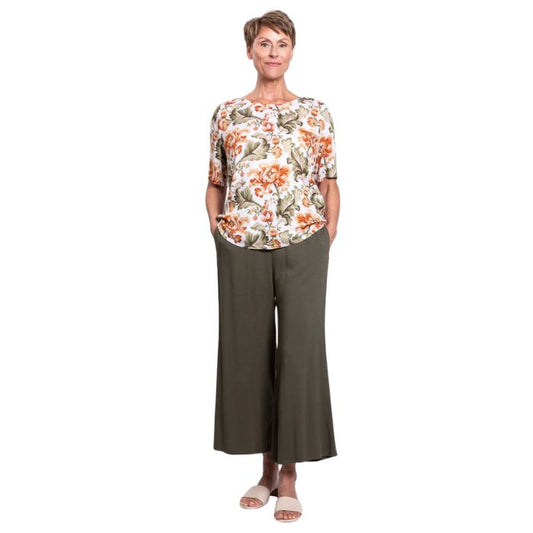female model wearing khaki tapestry print liza top and kkaki green gaylene capri pants front view on white background