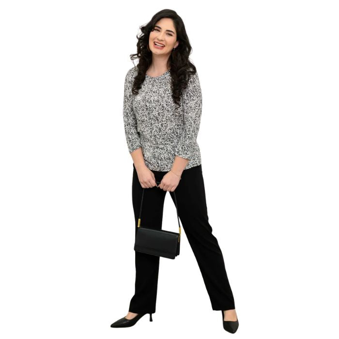 female model wearing rosette print margorie three quarter sleeve top and black nadia pants front view on white background