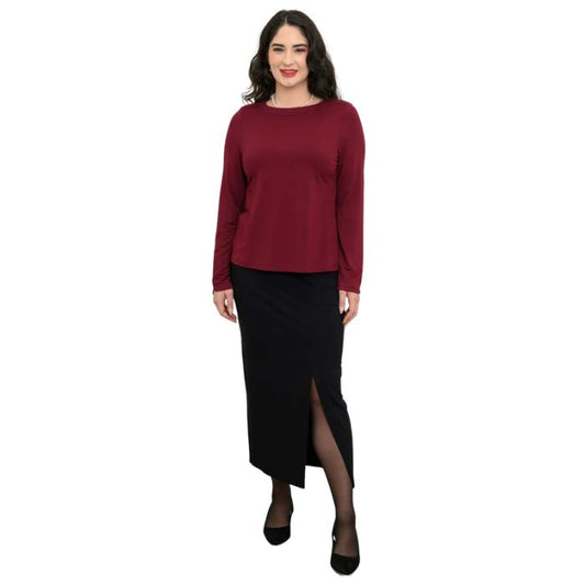 woman wearing burgundy red mona top and black eva skirt front view set on a white background