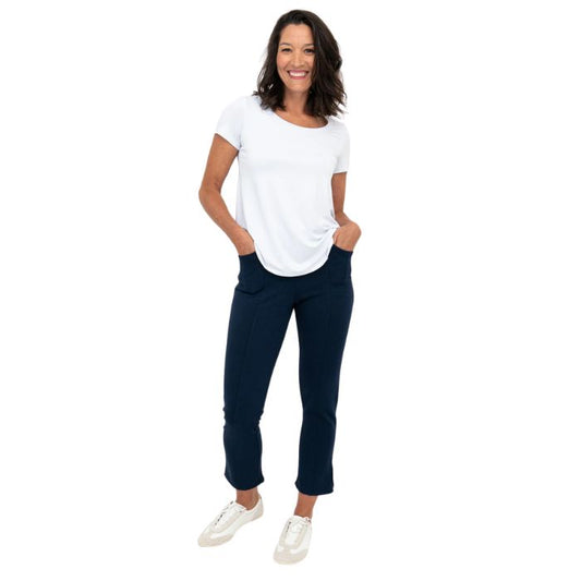 female model wearing indigo blue nadine cropped pants and white tessa tee front view on white background