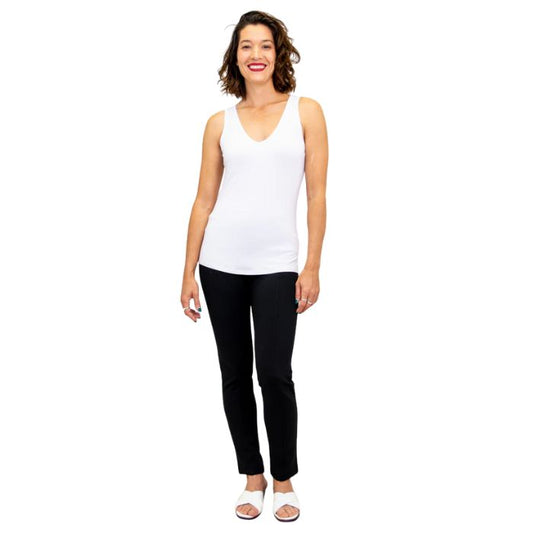 female model wearing white reanna tank top and black nadia pants front view on white background