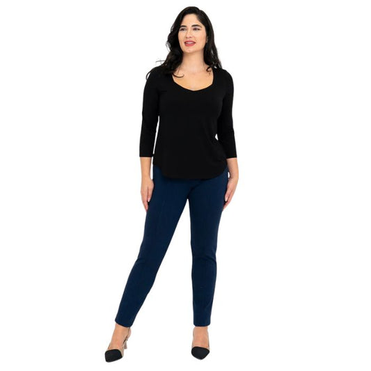 female model wearing black ritzy top and indigo blue nadia pants front view on white background