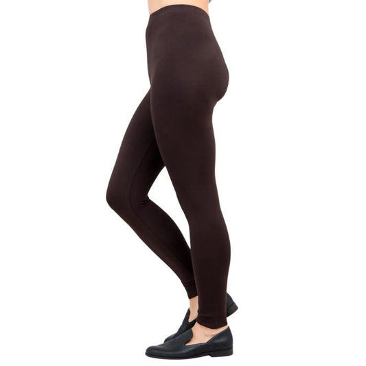 female model wearing coffee brown ruby leggings side view on white background