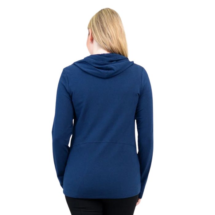 a woman wearing indigo blue seymour jacket waist up back view set on a studio white background