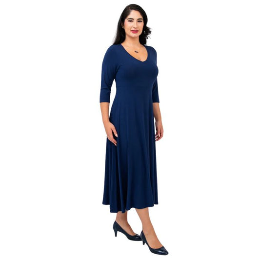 female model wearing indigo blue soul dress side view on white background