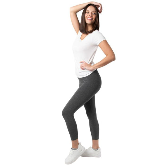female model wearing charcoal grey suri capri length leggings and white brenda tee side view on white background