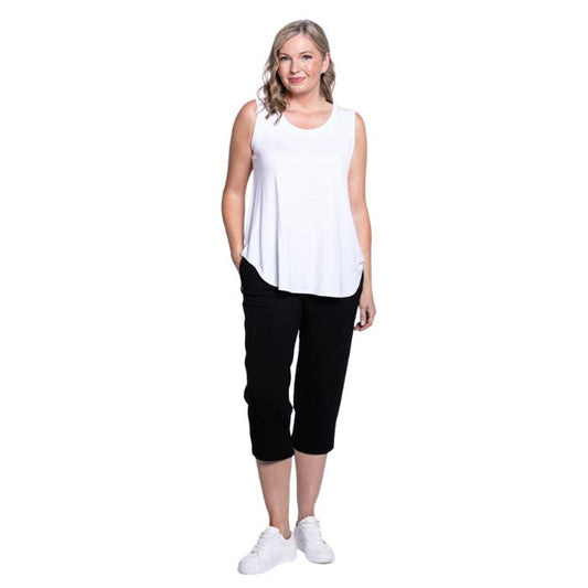 female model wearing black susan capri pants and white jazz tank top front view on white background
