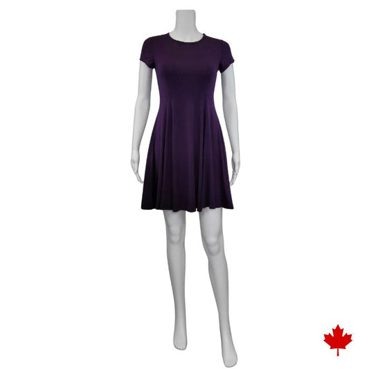 mannequin wearing plum purple swing dress front view on white background