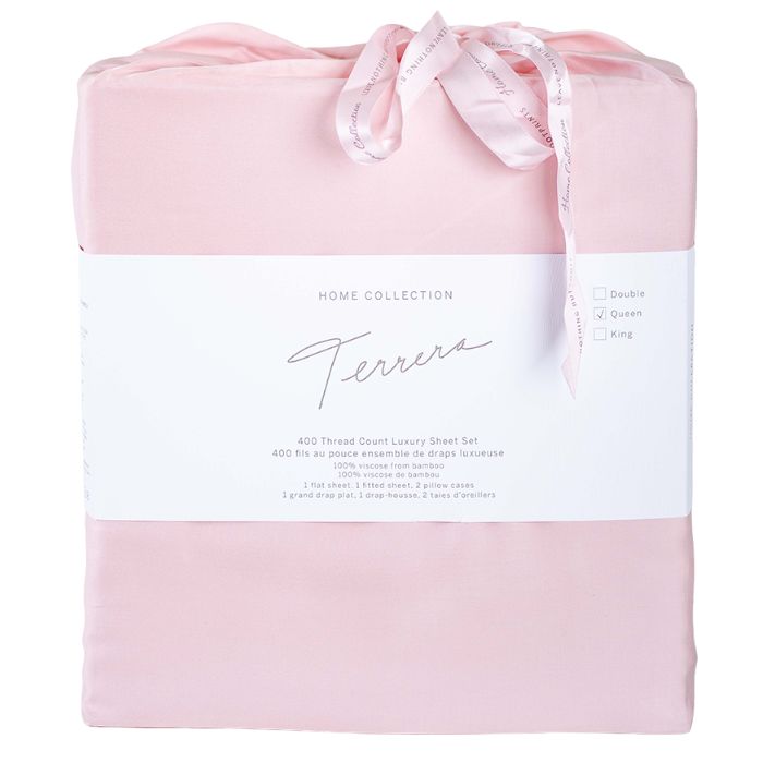pale rose pink bamboo fabric bag containg sheet set- flat sheet, fitted sheet and two pillowcases on white background