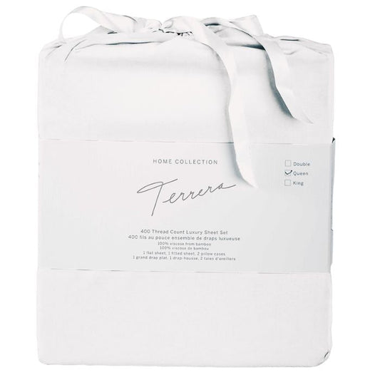 white bamboo fabric bag containg sheet set- flat sheet, fitted sheet and two pillowcases on white background
