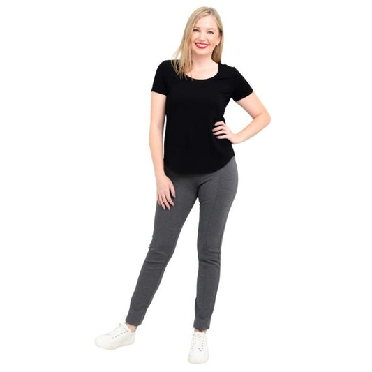 female model wearing black tessa tee and granite grey nadia pants front view on white background