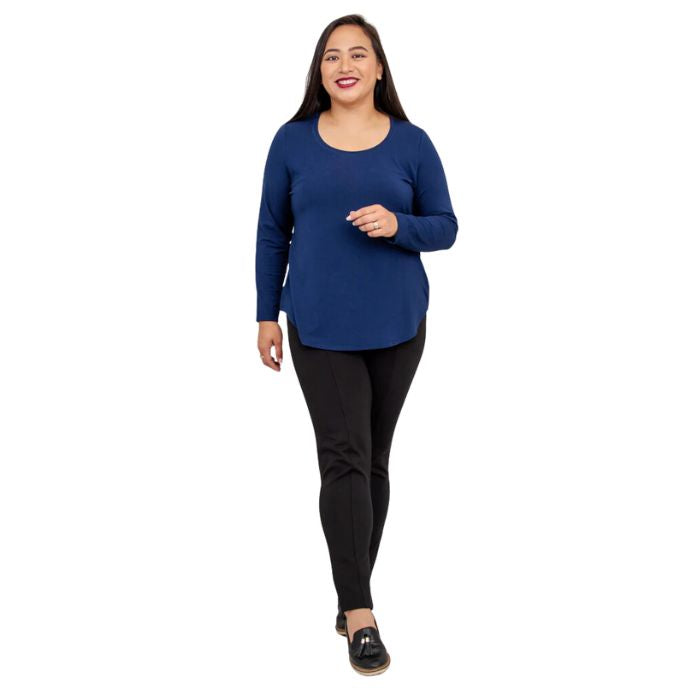 female model wearing tessa indigo blue long sleeve to and nadia black pants front view on white background