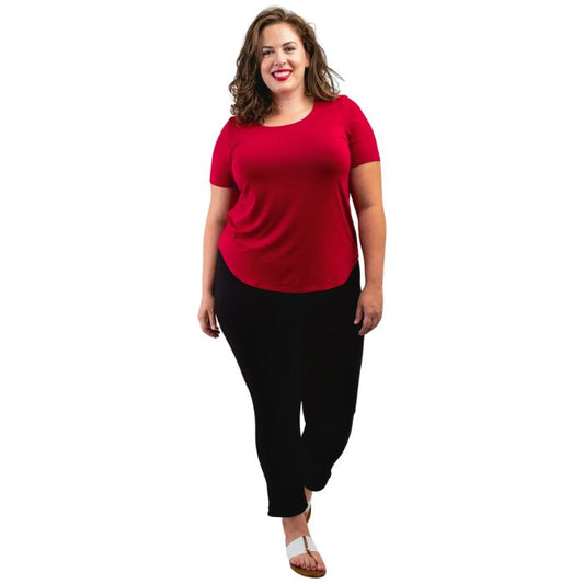 female model wearing lipstick red tessa tee and black nadia pants front view on white background