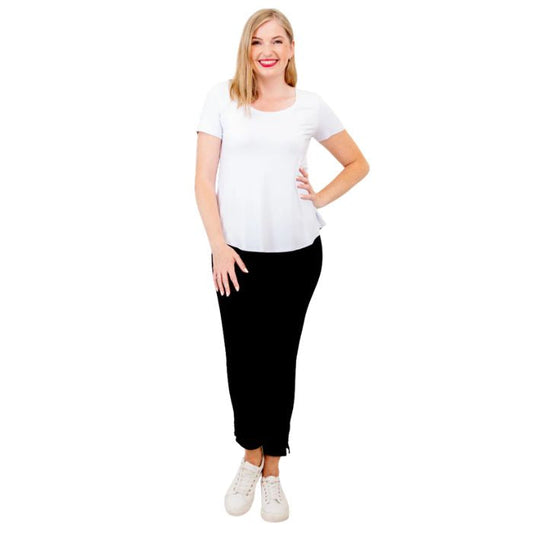 female model wearing white tessa tee and black nadine cropped pants front view on white background