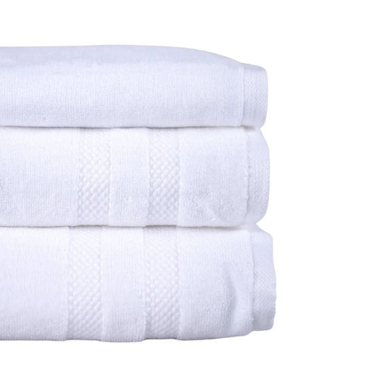 stacked white three piece towel set side view on white background