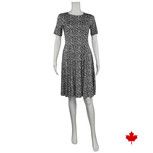 mannequin wearing leopard print twirl dress front view on white background