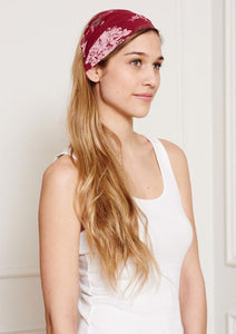 This Is J's Wide Headbands reverse from a unique print to a solid color. The fabric is ultra-soft and moisture-wicking and is soft enough to scrunch and fold into different widths. It comes twisted in the back for a comfortable tapered fit.  Made in Canada  Fabrication: 93% Viscose from Bamboo / 7% Spandex. $16.00 lovely flower burgundy red