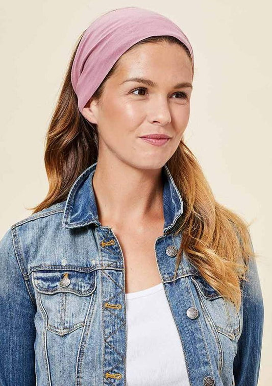 This Is J's Wide Headbands reverse from a unique print to a solid color. The fabric is ultra-soft and moisture-wicking and is soft enough to scrunch and fold into different widths. It comes twisted in the back for a comfortable tapered fit. Made in Canada Fabrication: 93% Viscose from Bamboo 7% Spandex. $16.00 palm leaf dusty rose pink