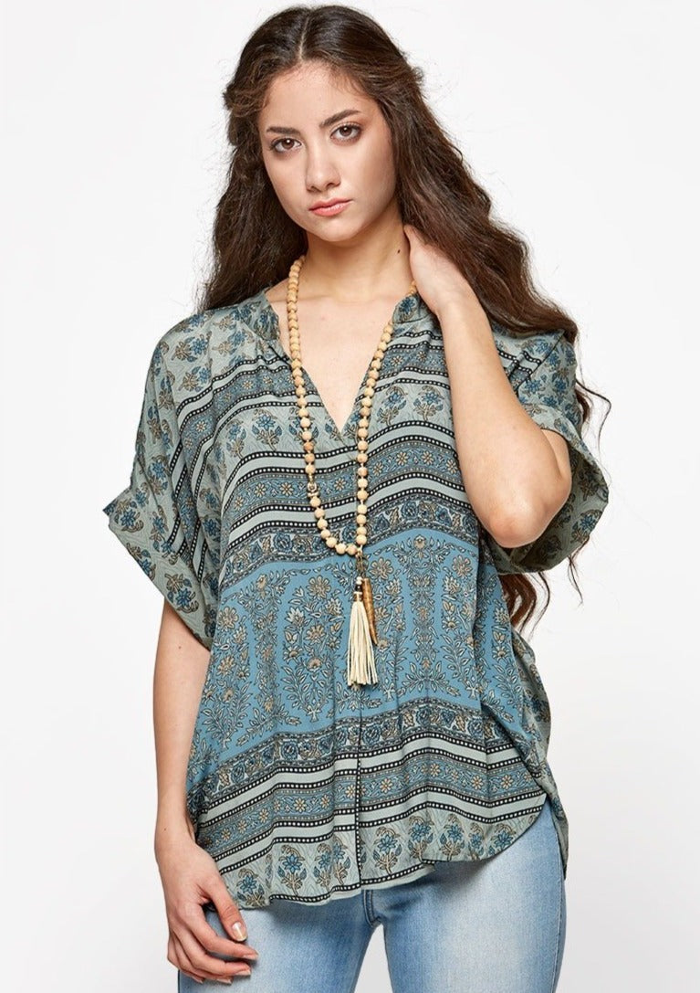 The Thoughtful Top is made with upcycled saris, that have an amazing history. Each of the high quality Rasgulla saris are collected by bartering in Indian villages and are re-fashioned by Guru for you! Fabric: Up-cycled one-of-a-kind Saris Step 1- Pick your style Step 2- Pick your size Step 3- Pick a Light or a Dark Print Step 4- You receive a Specially selected one of a kind piece just for YOU! ** Image is used for an example, every print is Different** GURU FOR LIFE $65.00