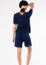 Perfect for gifting to yourself or to someone you love. The Vivian PJ sleep set comes with a luxurious and comfortable button down top and pull-on shorts.  Made with signature soft viscose from bamboo, you’ll have a good night’s rest in these classic PJ’s. Fabrication: 95% Viscose from Bamboo 5% Spandex TERRERA Ink Blue $90.00