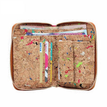The Ladies Speckled Cork Wallet is crafted from sustainable multi colored cork. It features a sleek zip-around design that opens to reveal a well-organized interior. This petite yet practical vegan wallet offers plenty of card slots, a few compartments and a snap-shut coin pocket for loose change. Will also fit most cell phones!  KUMA $44.00 colour Natural