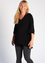 The Kinsley Tunic is a beautiful A-line tunic with a cross-over front that fits and flatters the body.  Kinsley features a V-neckline, airy bracelet-length sleeves for movement and cross-over hem. Easily complete your outfit with a pair of leggings. Fabrication: 95% Viscose from Bamboo 5% Spandex TERRERA colour black $85.00
