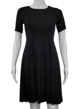 The ﻿Black Bamboo Twirl Dress is a simple and elegant style with a luxurious look and feel. Similar to the Swing Dress, it is a compliment to all body shapes with its princess line fit, round neck, 3/4 sleeve and 3" more in length then the swing dress. Proudly made in Canada 92% rayon from bamboo, 8% Spandex  Eco-Essentials $80.00