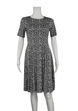 The Leopard Print Bamboo Twirl Dress is a simple and elegant style with a luxurious look and feel. Similar to the Swing Dress, it is a compliment to all body shapes with its princess line fit, round neck, 3/4 sleeve and 3" more in length then the swing dress. Proudly made in Canada 92% rayon from bamboo, 8% Spandex  Eco-Essentials leopard print $80.00