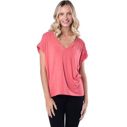 top of female model wearing coral pink alicia v-neck top front view on white background